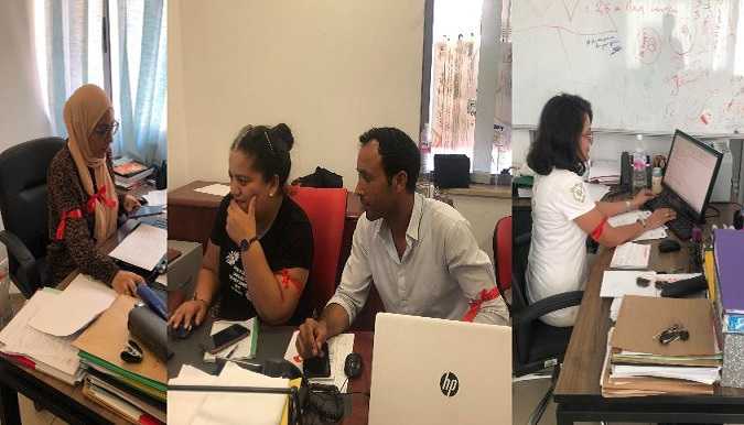 أعوان هيئة الانتخابات يرتدون الشارة الحمراء احتجاجا على عدم تسوية وضعياتهم